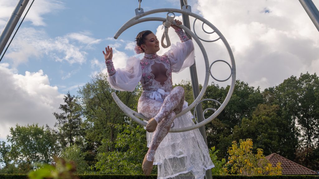 The aerial acrobat on Ariel Moon, a crescent-moon rig above the front garden