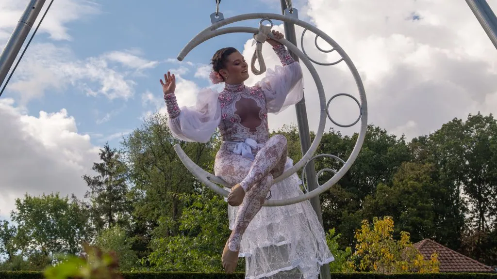 The aerial acrobat on Ariel Moon, a crescent-moon rig above the front garden